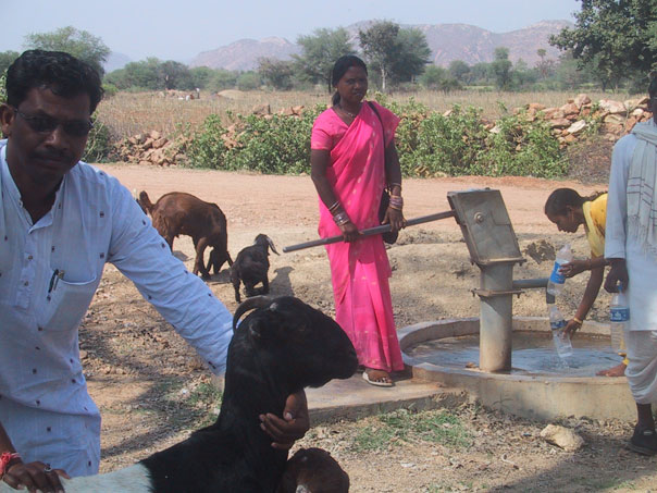 A well provides drinking water for people and livestock
