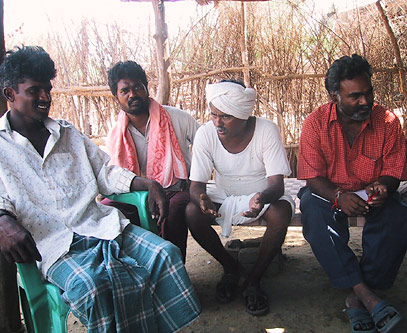 Margam Mutthaiah (second from right), the first farmer in Punukula to use Non-Pesticide Management, tells his story.